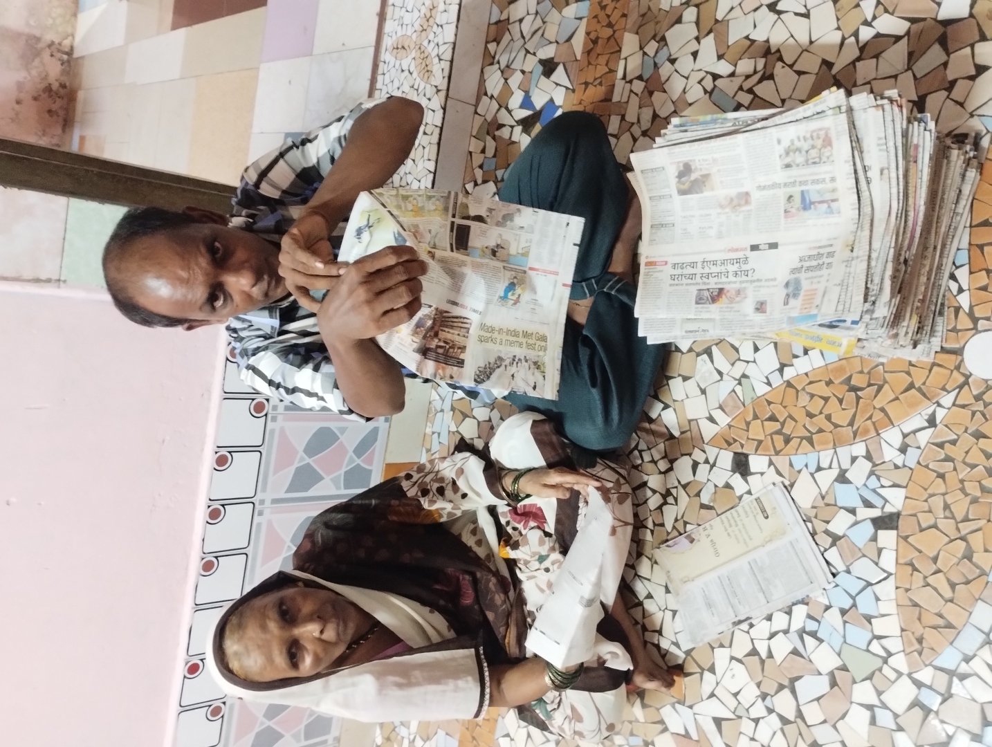 Crafting paper bags out of newspapers, Bashir makes a living