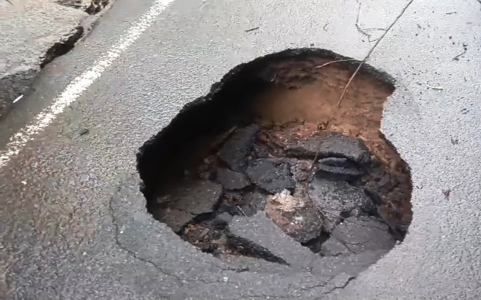 Portion of road at Madel-Piqueno caves in, poses threat to motorists