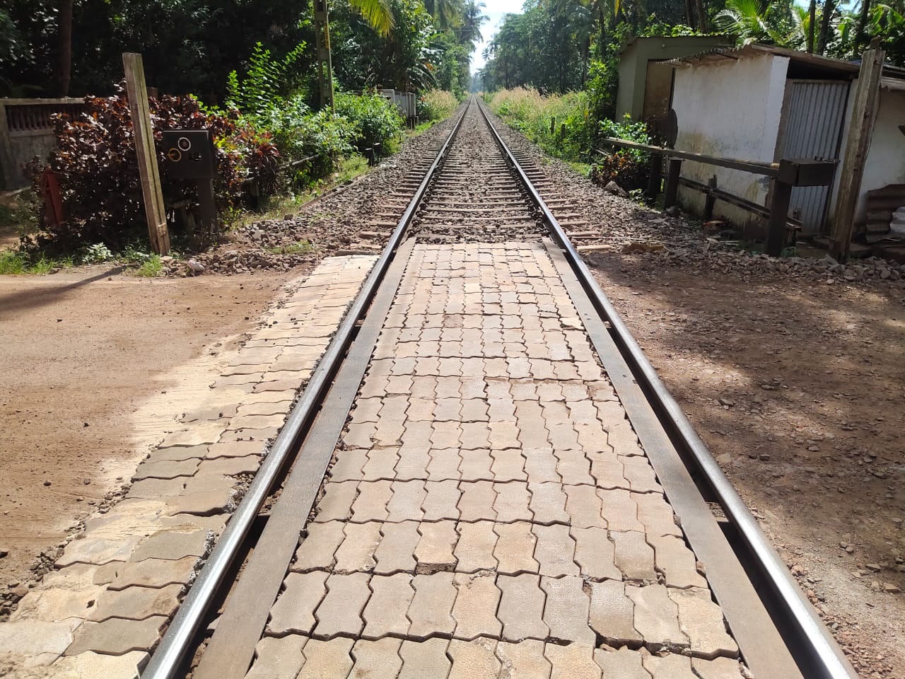 SWR repairs uneven road at Velsao railway gate