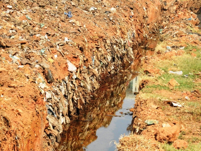 Men at work on PDA ground unearth plastic waste