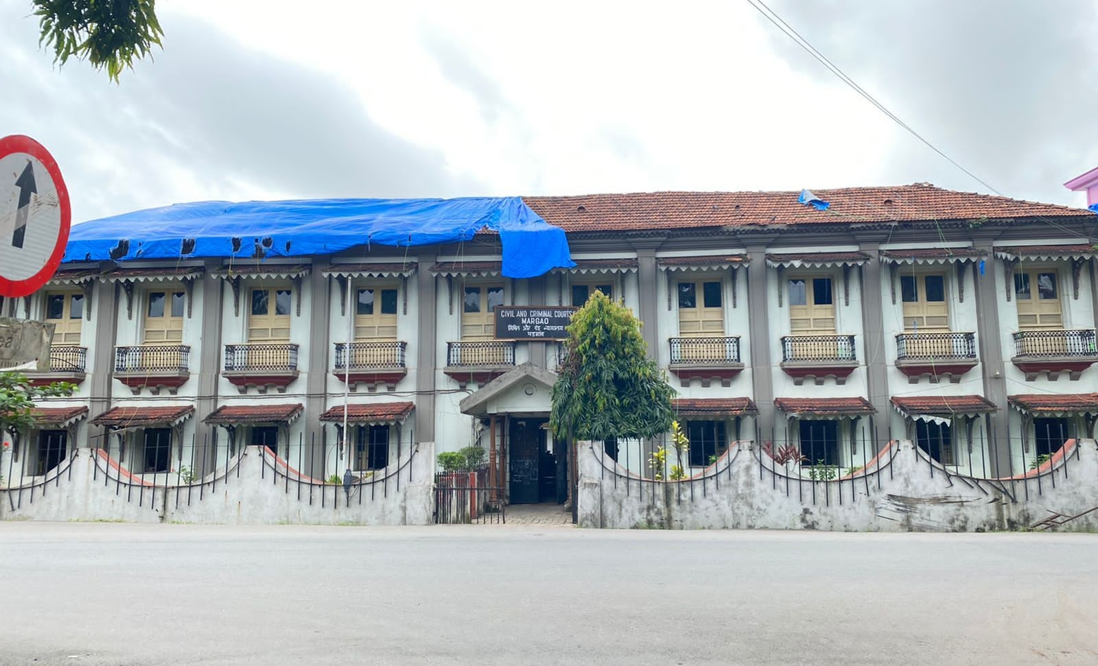 Plastic sheet covering Margao court building roof blows off